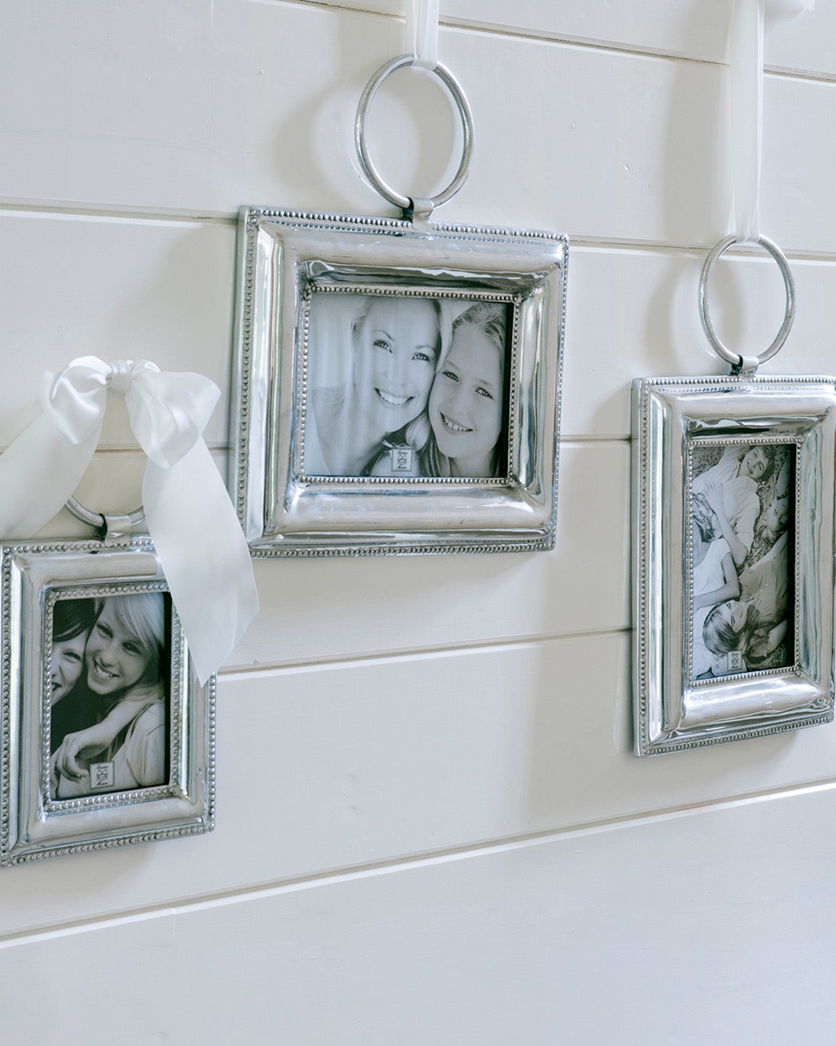 CORDOBA PHOTO FRAMES SILVER hanging on a white wall by Riviera Maison