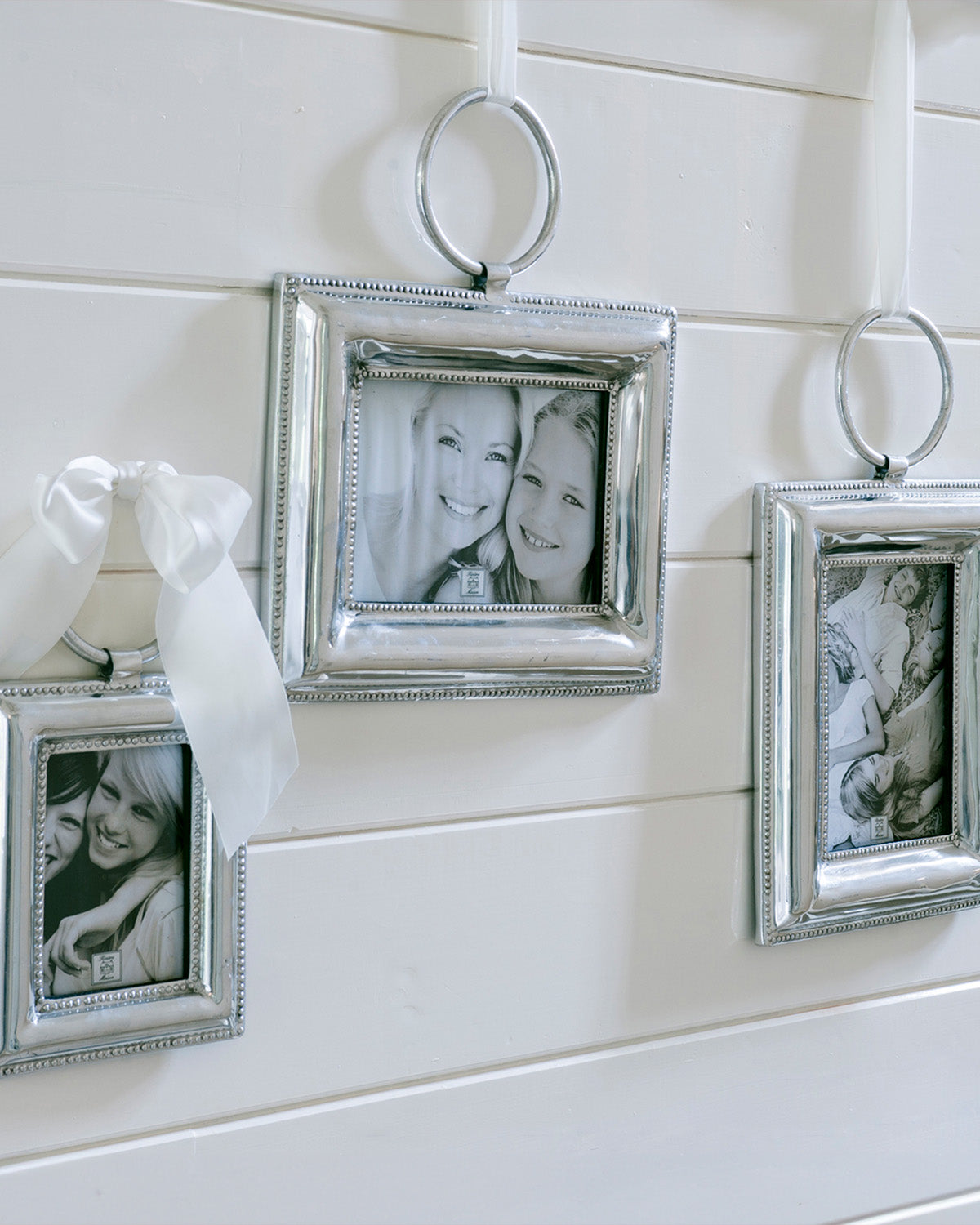 CORDOBA PHOTO FRAME SILVER hanging on a white wall by Riviera Maison