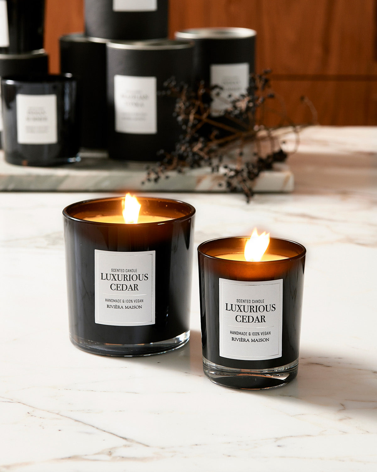 Two CEDAR SCENTED CANDLES  in black glasses by Riviera Maison