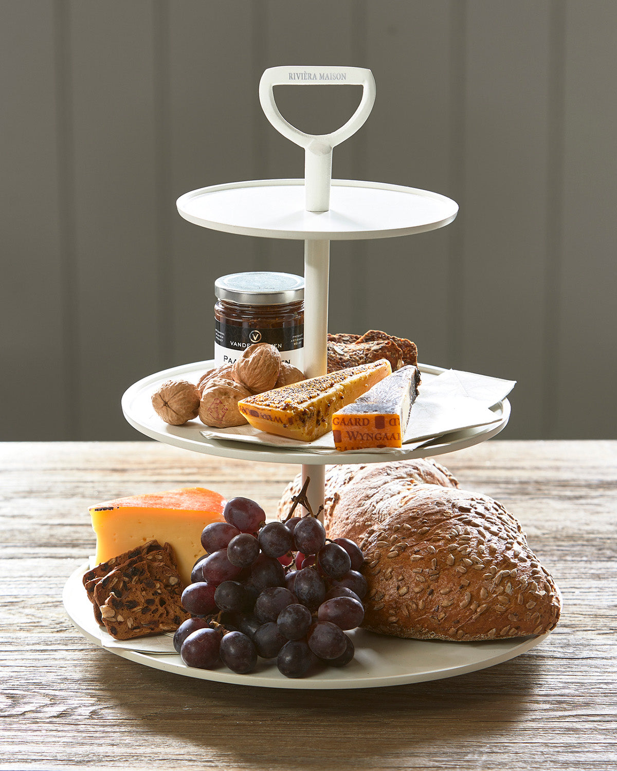 ETAGÈRE white color made of aluminum, decorated with bread, cheese, fruits, and jam