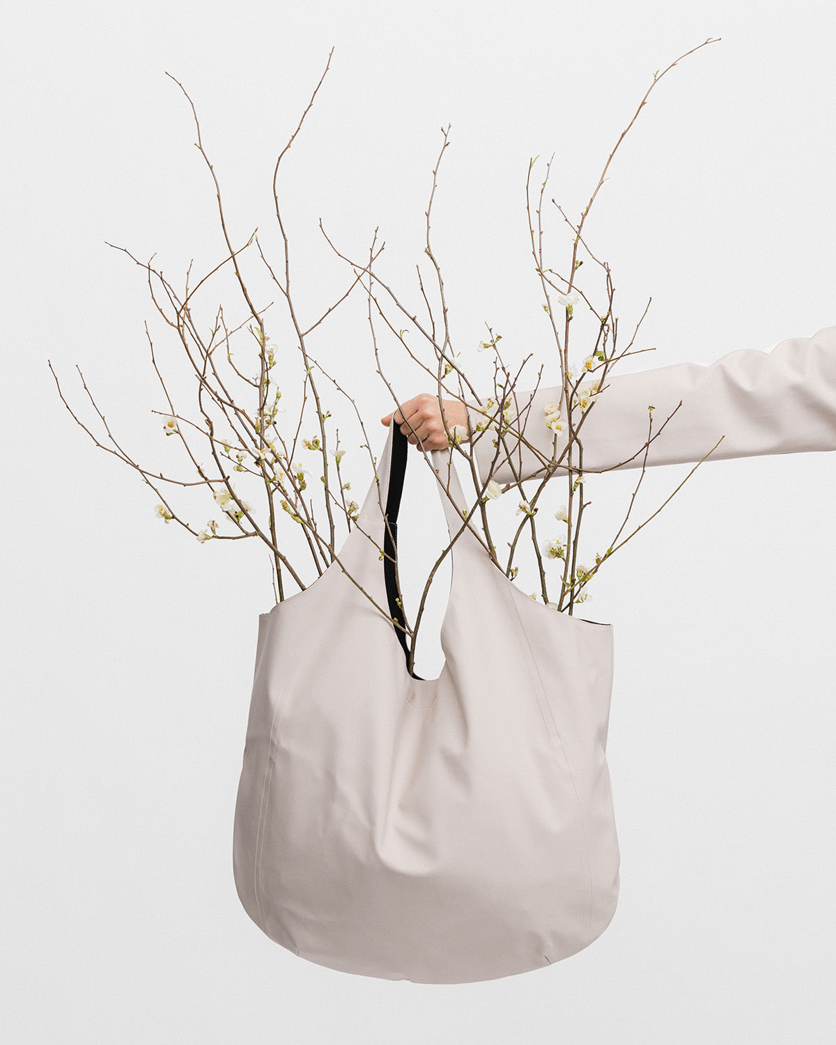 Tote Bag in color light sand by Stutterheim decorated with flowers