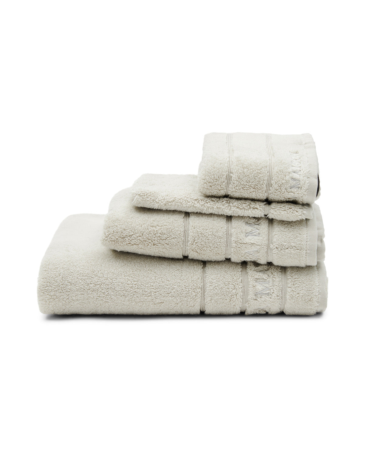 TOWELS  soft, thick, stone-colored  on a chair by Riviera Maison