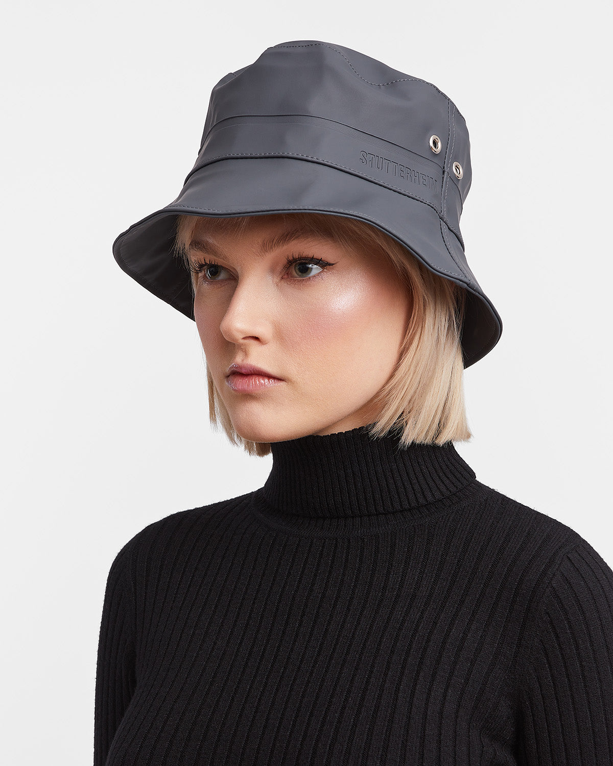 A woman with Bucket Hat in color charcoal by Stutterheim 