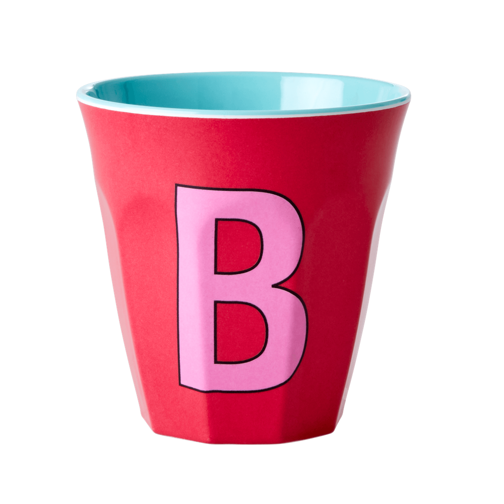 Melamine cup by Rice by Rice in the colors red, pink, and aqua with the letter "B"