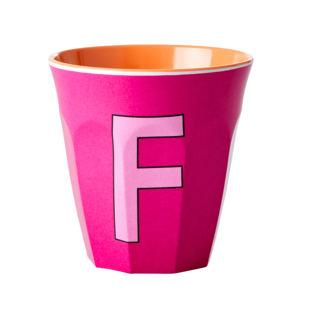 Melamine cup by Rice by Rice in the colors berry, pink, and orange with the letter "F"
